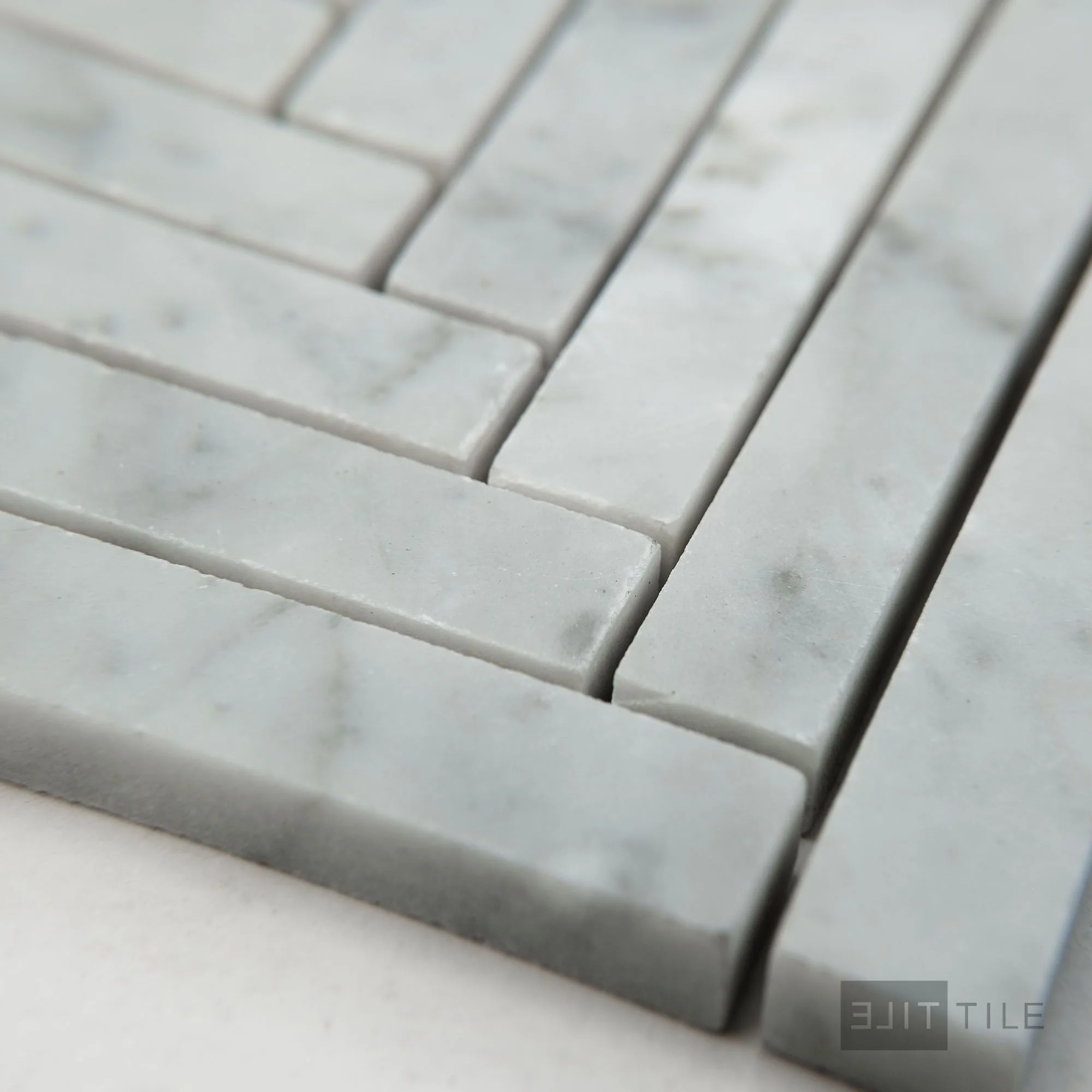 White Carrara Marble 5/8X6 Herringbone Honed Mosaic - Image 3